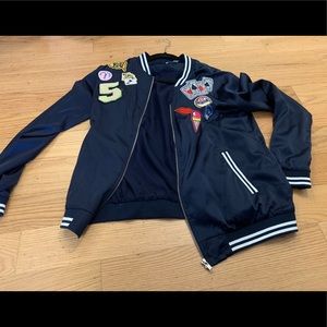 Blue bomber jacket with patches